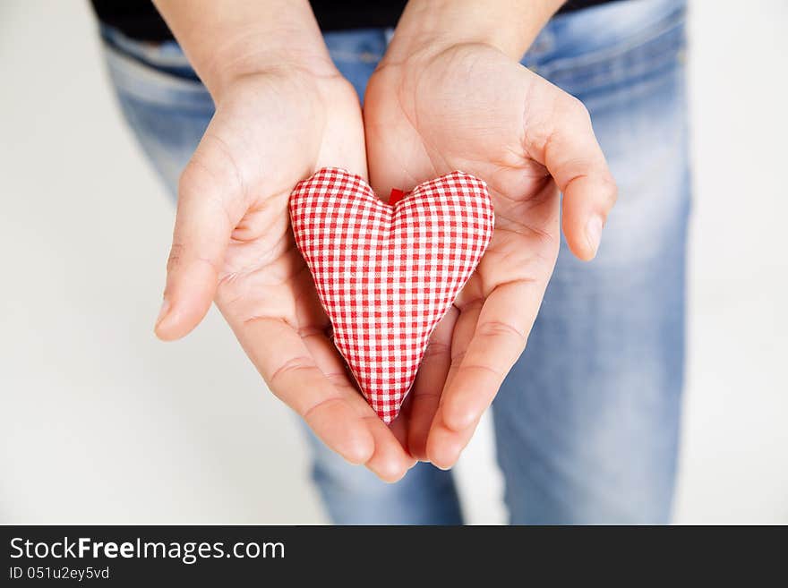 Woman hands holding a heart