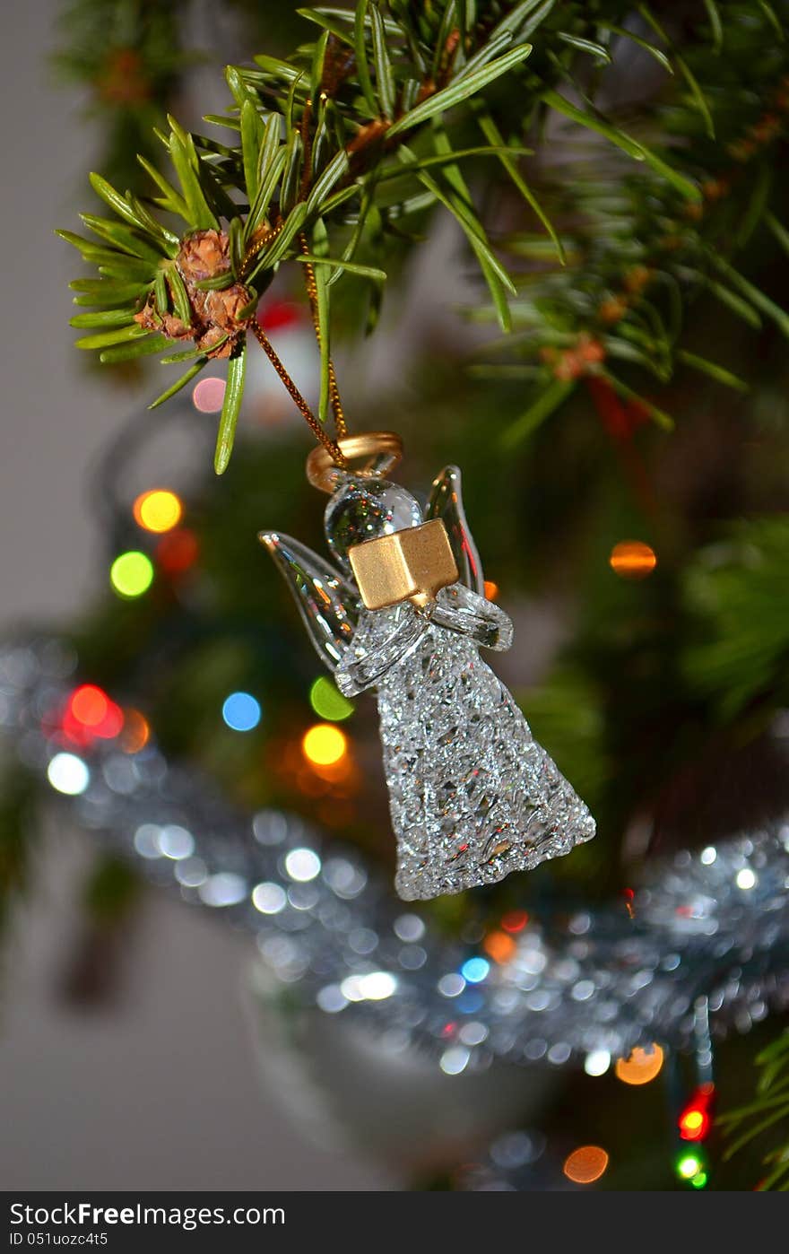 Image of a glass angel on a Christmas tree. Image of a glass angel on a Christmas tree