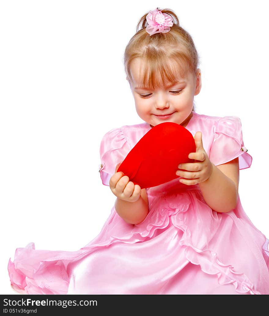 Beautiful girl in a wreath holding a heart on a white background