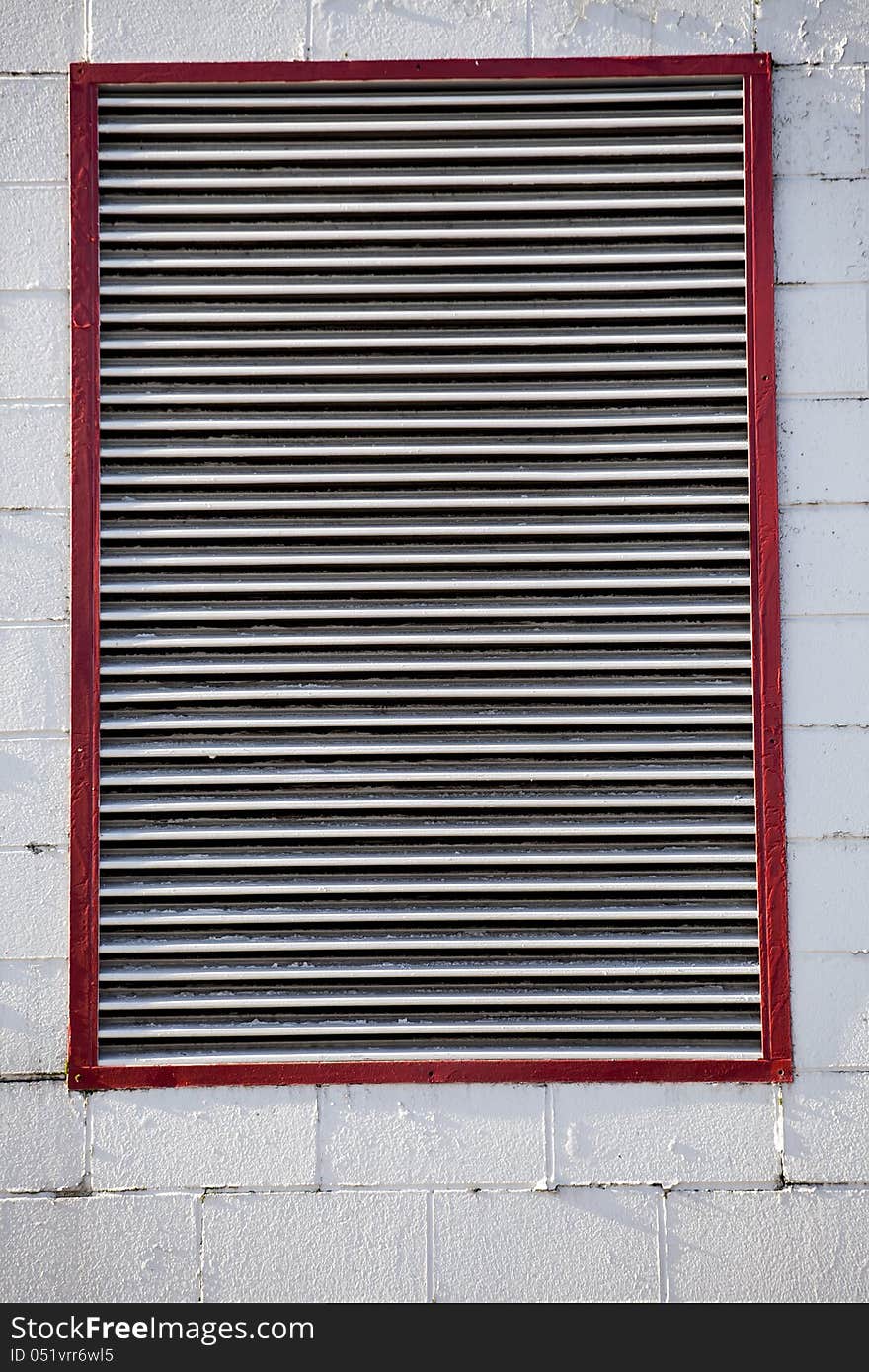 Large Industrial Vent on Cinder Block Wall