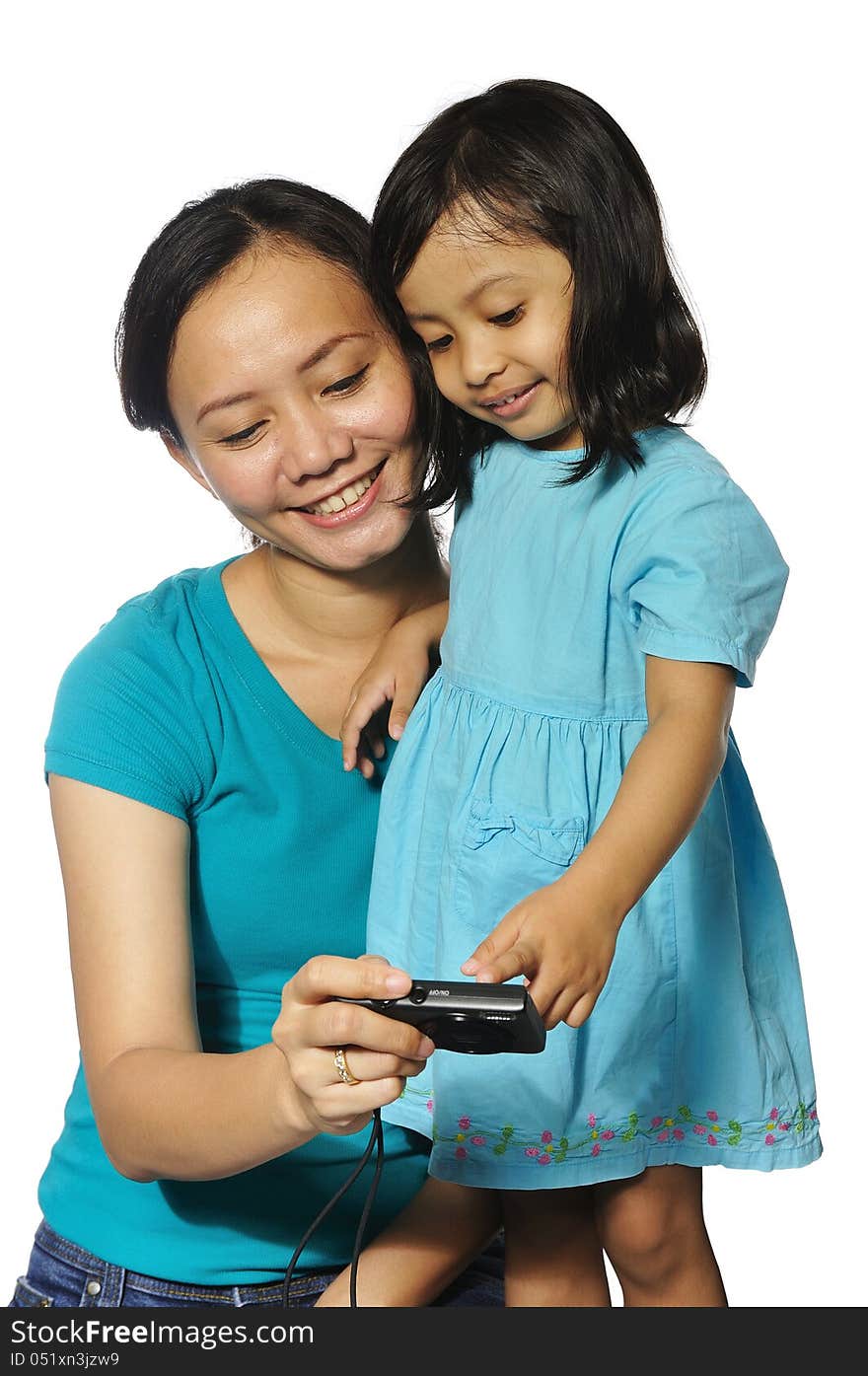 Mother and daughter taking own photography with camera