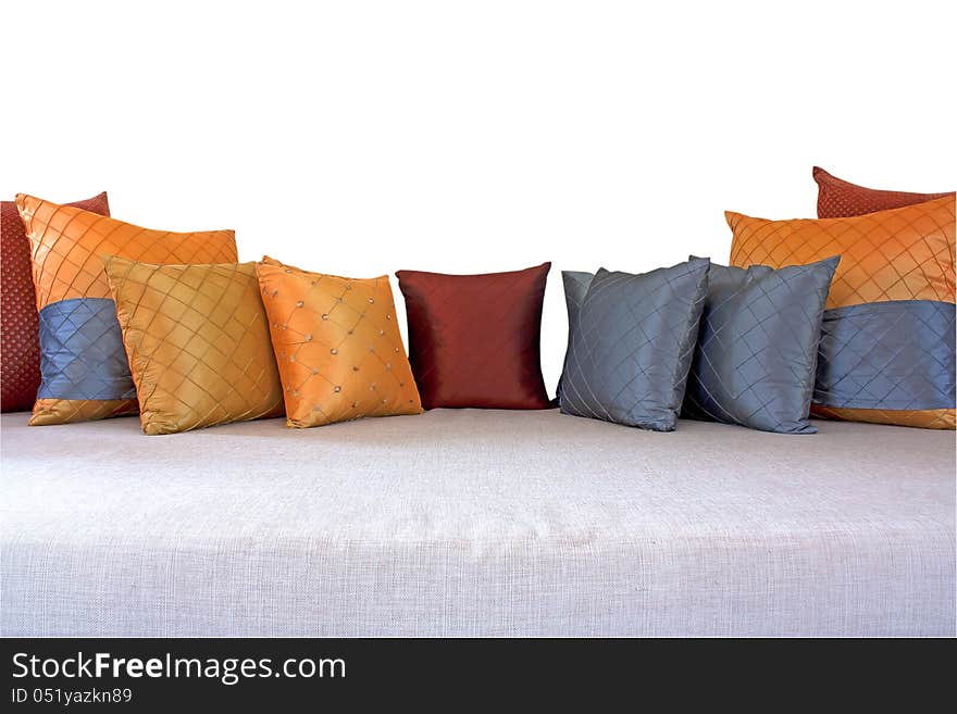 The colorful pillows scattered on the table.