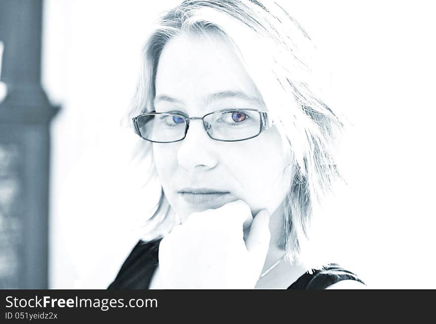 A young attractive caucasian girl wearing modern prescription eye glasses, spectacles, featuring the frames, glasses and eyes. A young attractive caucasian girl wearing modern prescription eye glasses, spectacles, featuring the frames, glasses and eyes.