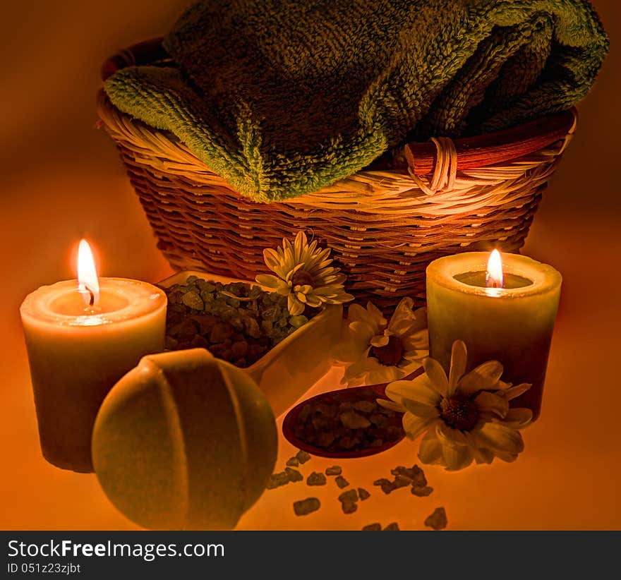 Sea salt, candles, flowers and towel in spa still life. Sea salt, candles, flowers and towel in spa still life