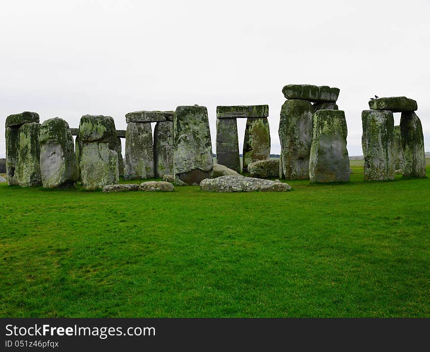 Stonehenge is a prehistoric monument in the English county of Wiltshire. Stonehenge is the remains of a ring of standing stones set within earthworks. It is in the middle of the most dense complex of Neolithic and Bronze Age monuments in England.