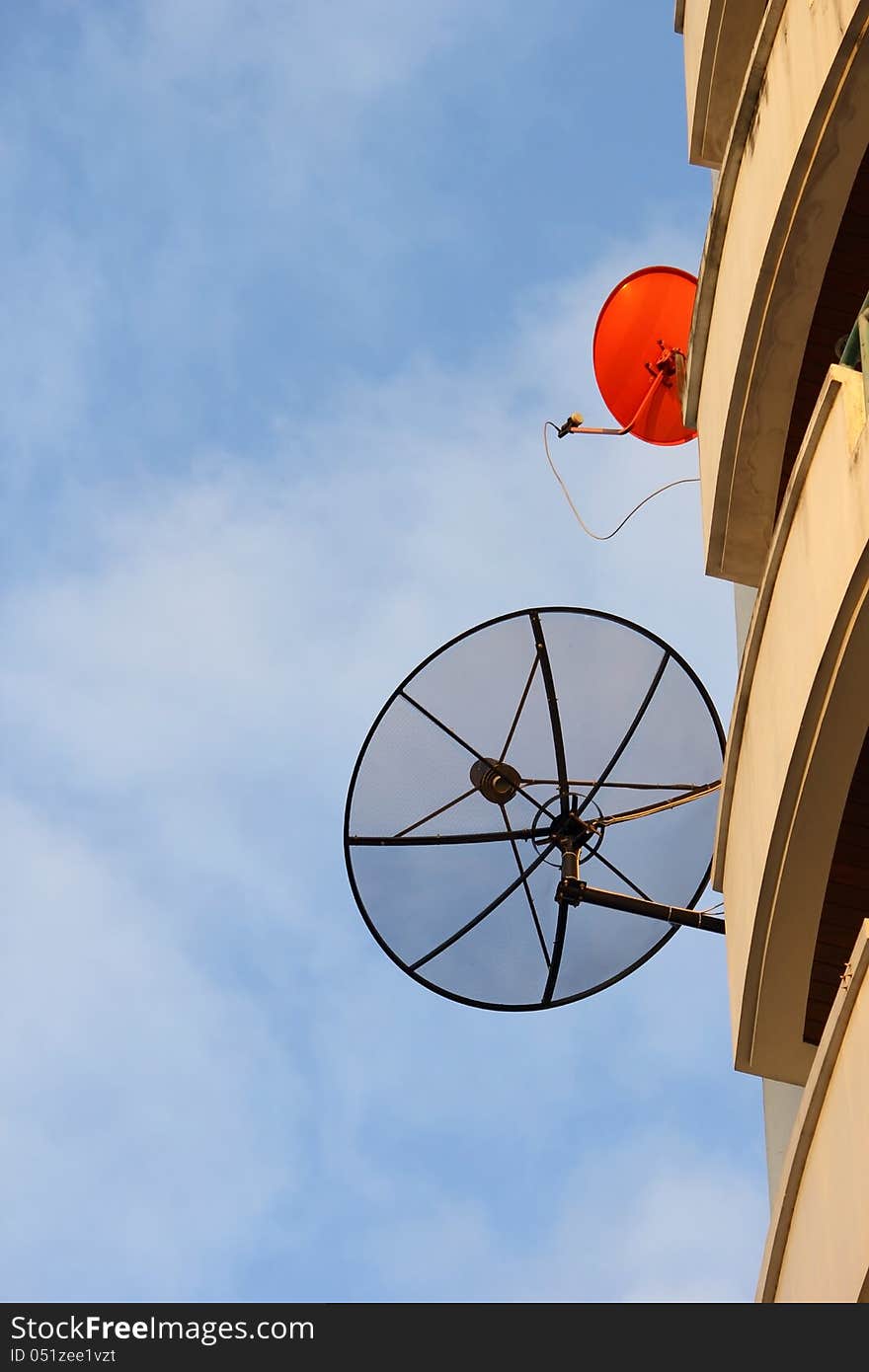 Satellite dishes, black and red corner.