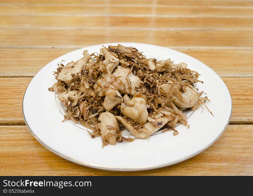 Asian style fried pork on dish