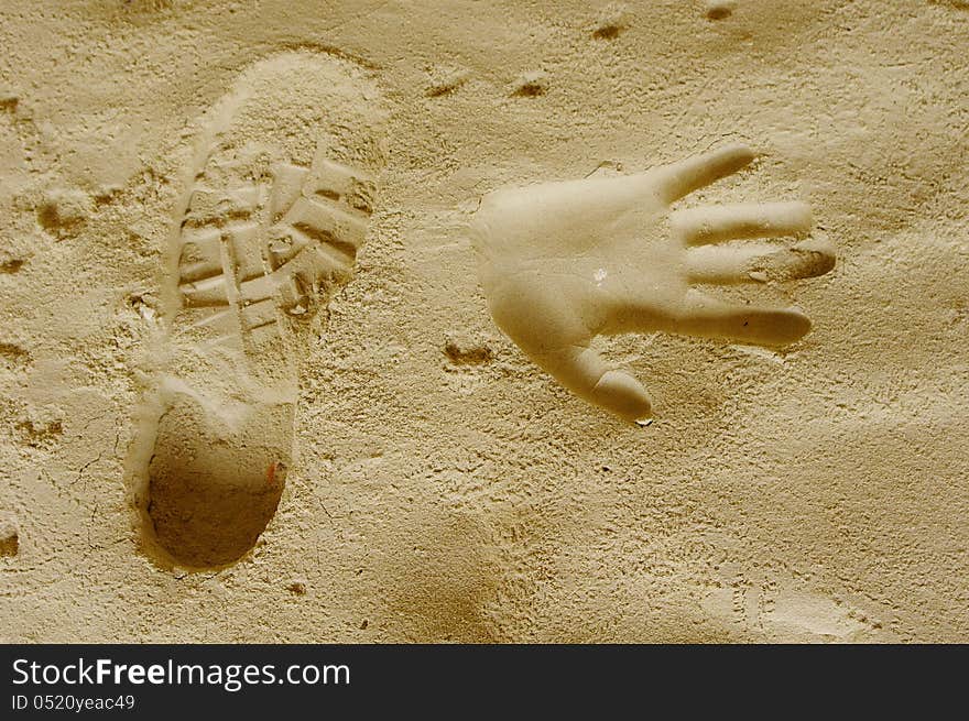 Handprints And Trekking Shoe Print In A Sand Cave, Bulgaria