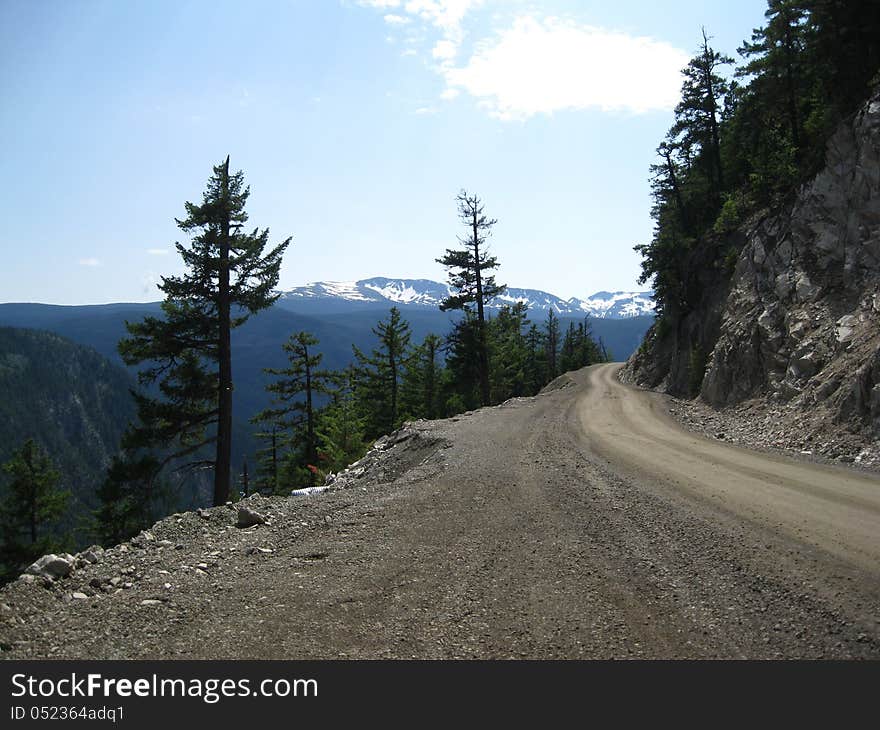 A narrow road to the mountains going to the coastal area. A narrow road to the mountains going to the coastal area.