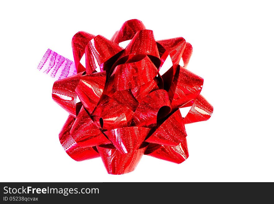 Decorative red bow on white background