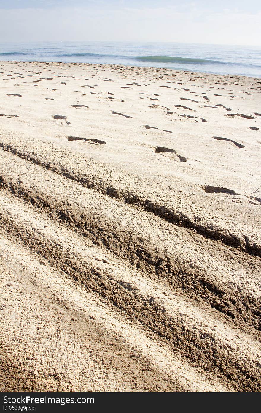 Imprint of the shoe on sand and lines