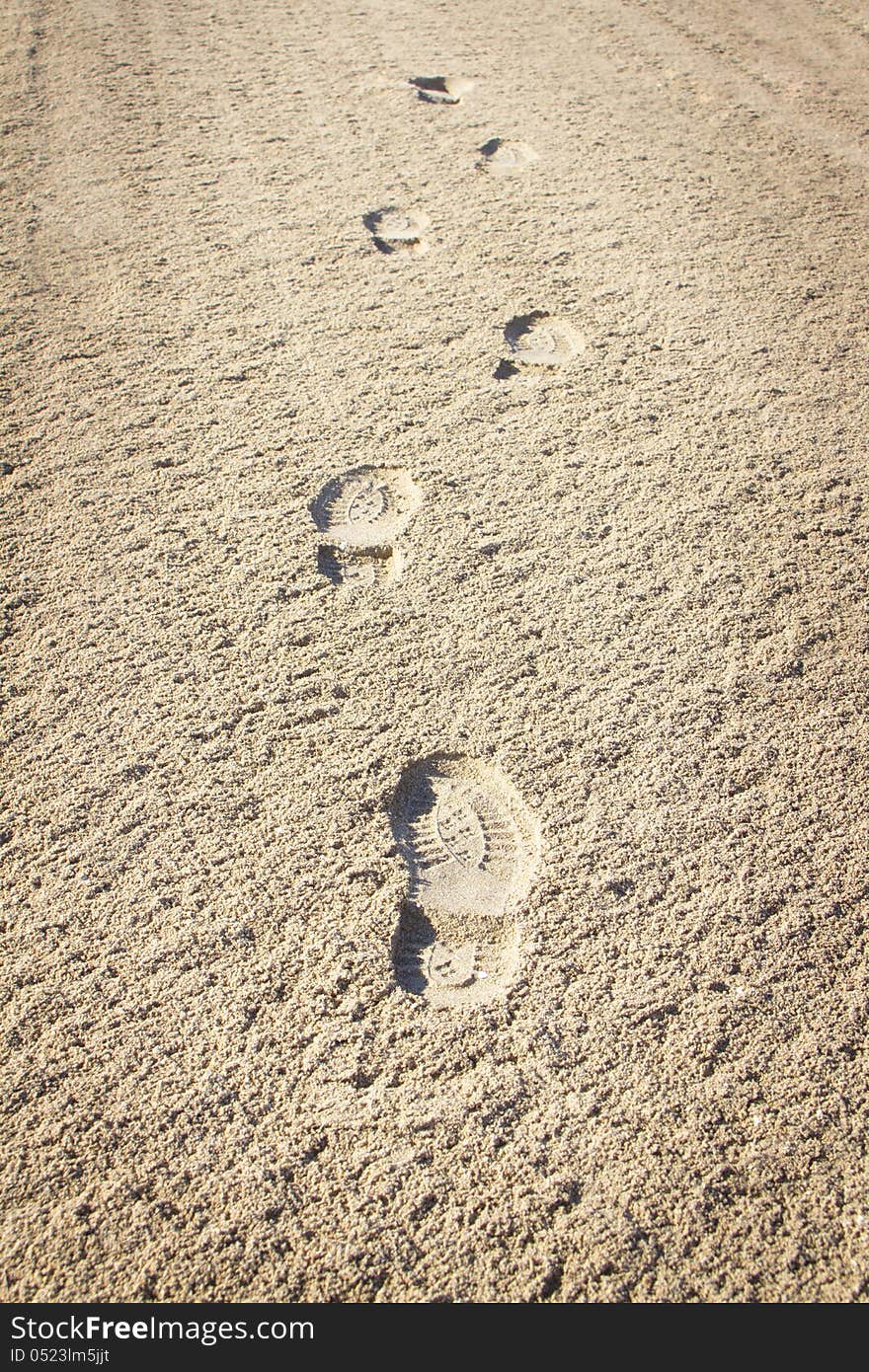 Footprints, Beach. Imprint of the shoe on sand