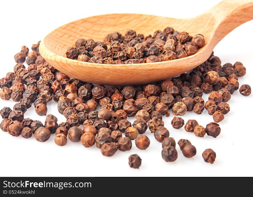 Spoon with pepper seeds