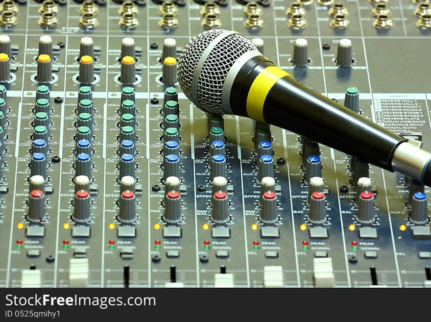 Microphone on a sound mixer or mixing desk sound studio. Microphone on a sound mixer or mixing desk sound studio