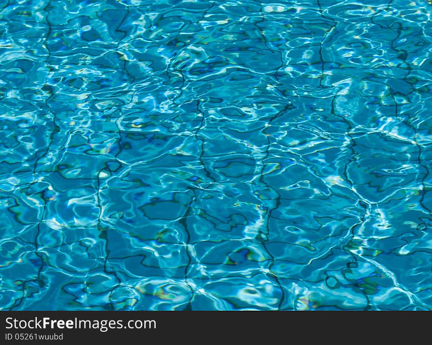 Blue swimming pool water background. Blue swimming pool water background