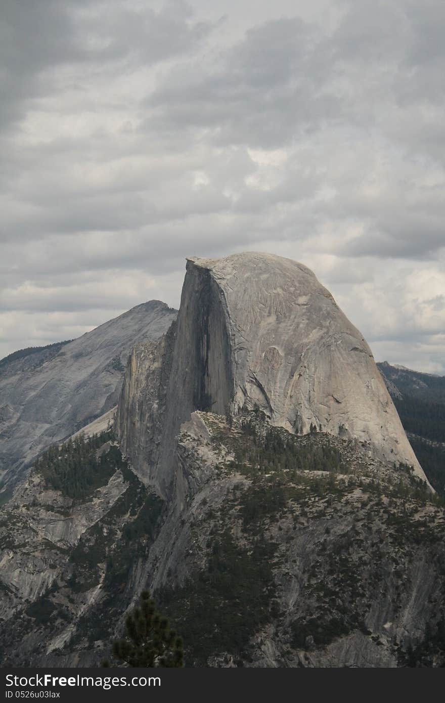 Shot of Half Dome, eye level, cloudy sky. Shot of Half Dome, eye level, cloudy sky.