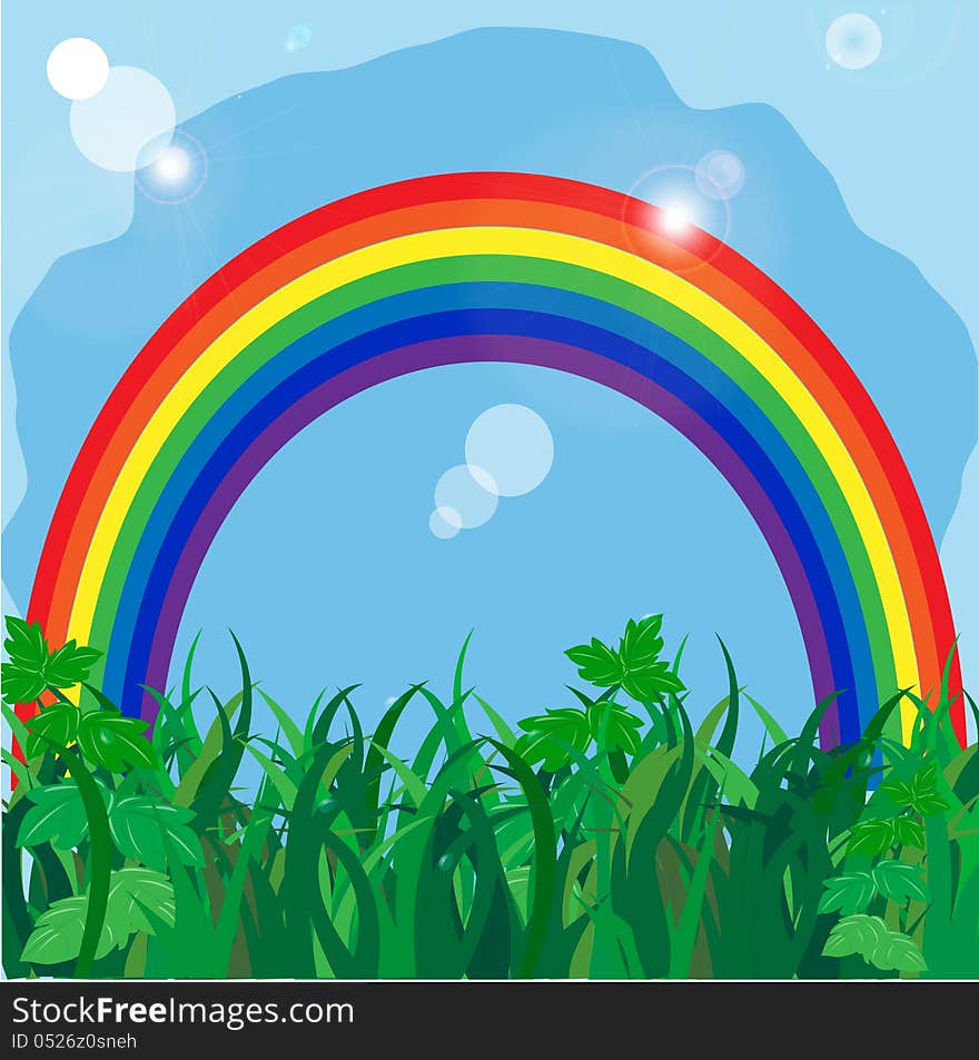 rainbow on to the meadow with a green grass on a background blue sky. rainbow on to the meadow with a green grass on a background blue sky