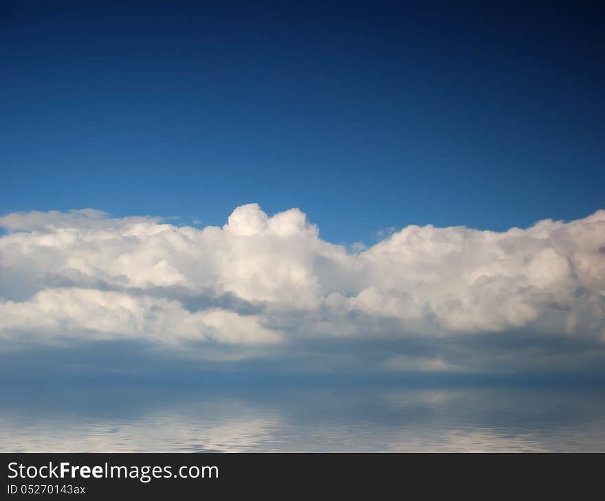 White fluffy clouds in blue sky