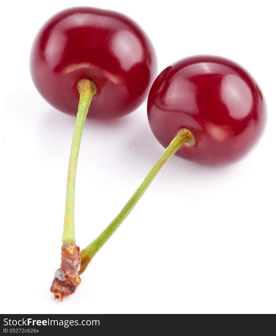 Two cherries on a white background.