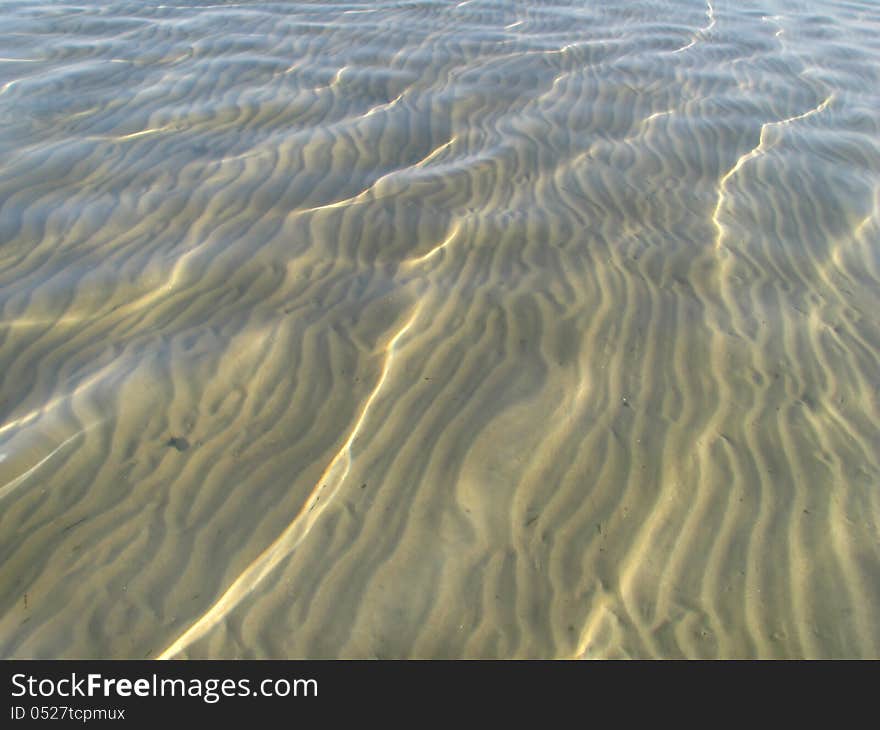 Sand field under the clear water surface. Sand field under the clear water surface.