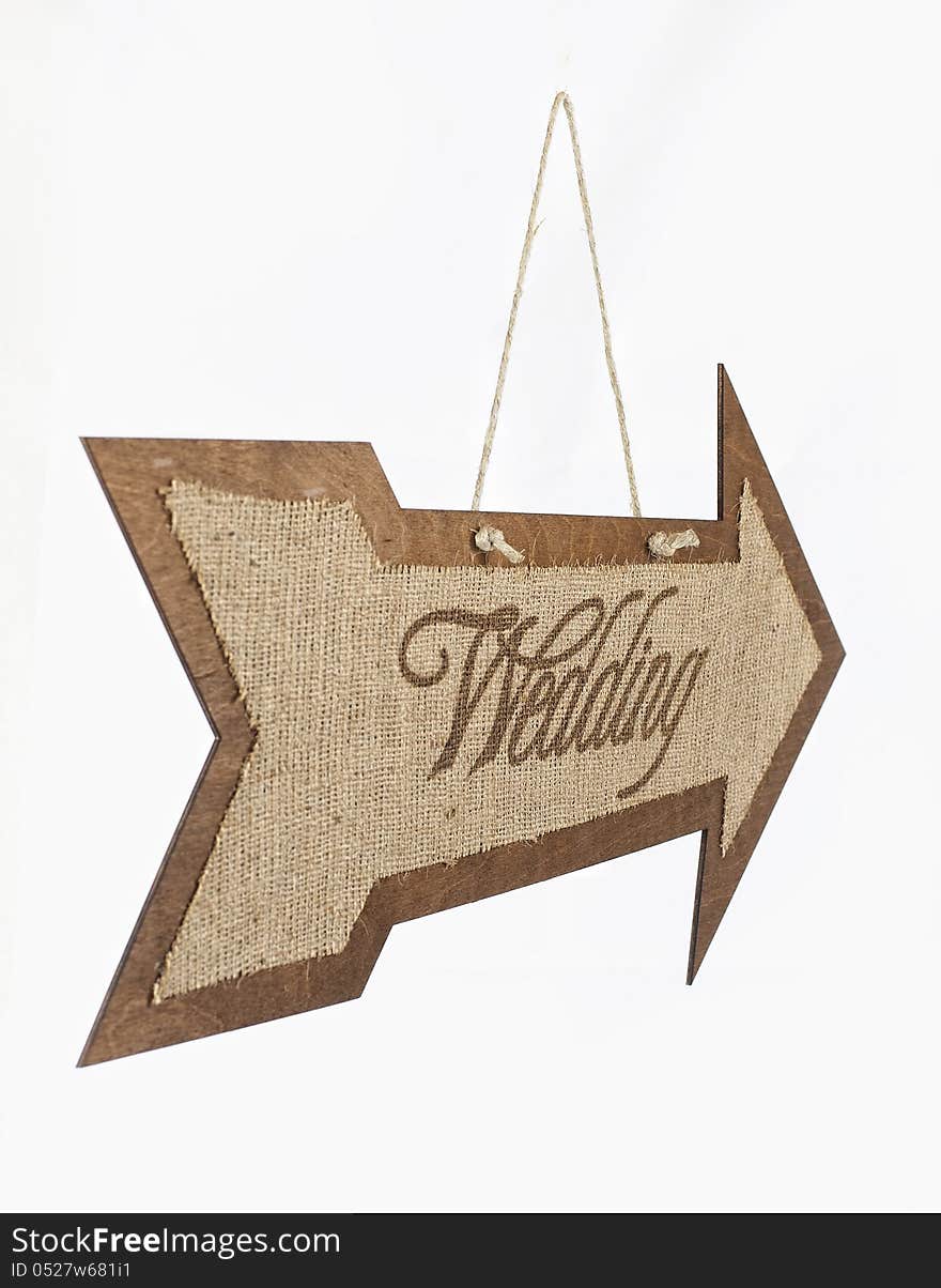 Burlap wedding sign arrow on the wood