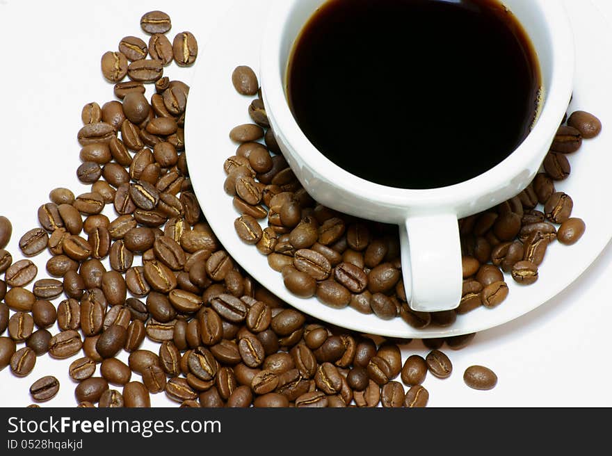 Cup of coffee with coffee beans