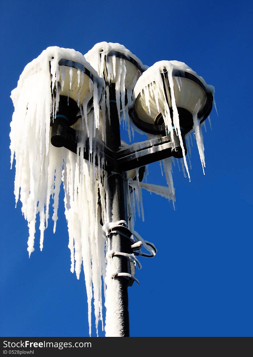 Street light coved in icicles. Street light coved in icicles.