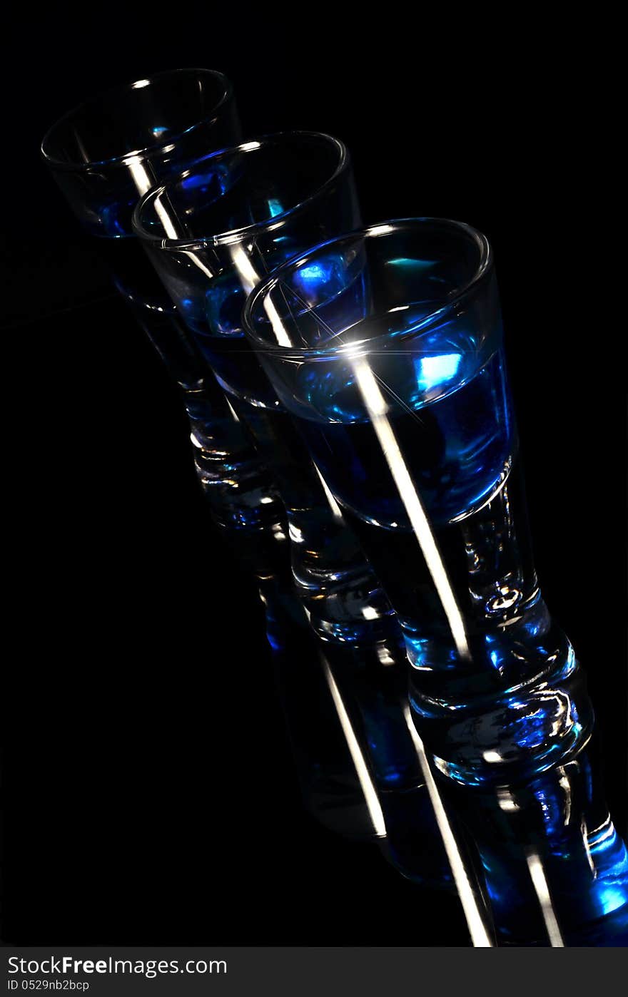 Three shot glasses vertical