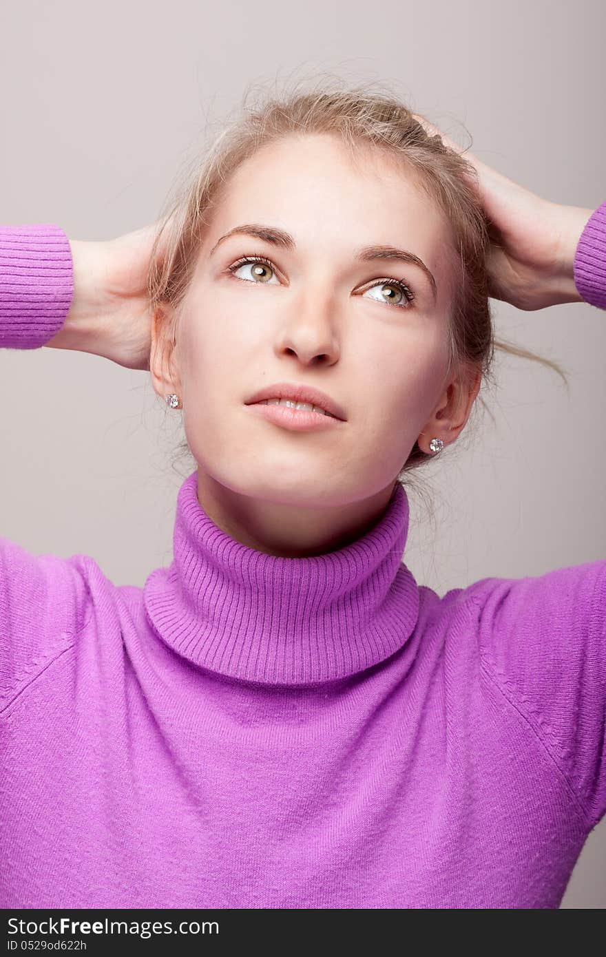 Studio portrait of self-satisfied woman