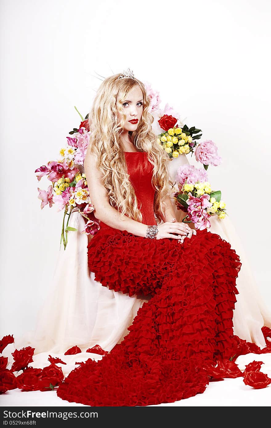 Beautiful Fashion Girl with red makeup and Roses. Hairstyle