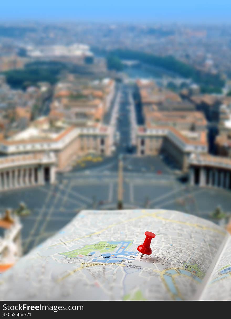 Push pin pointing St. Peter´s square on Vatican city map. Push pin pointing St. Peter´s square on Vatican city map