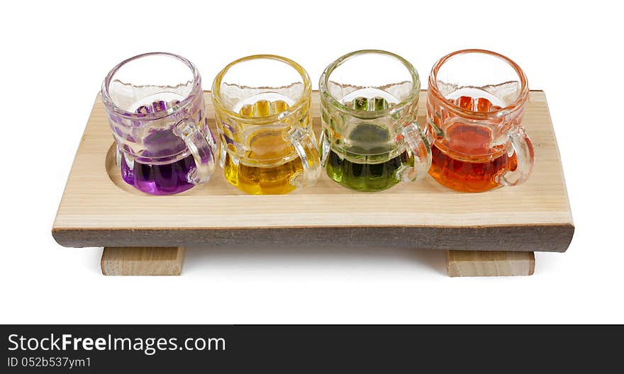 Four little pitchers on a carved wooden tray. Four little pitchers on a carved wooden tray