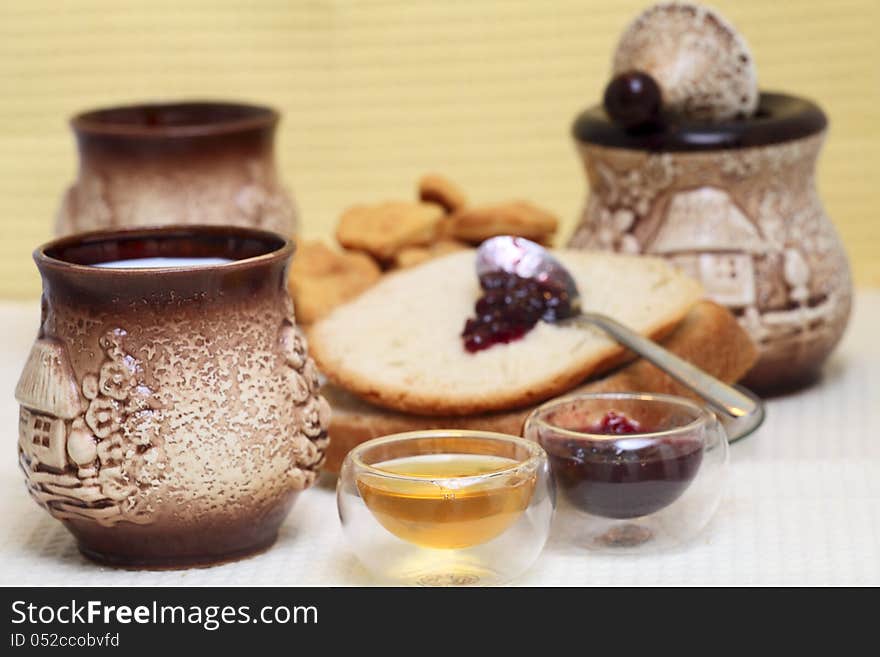 Homemade bread with redberries jam and honey