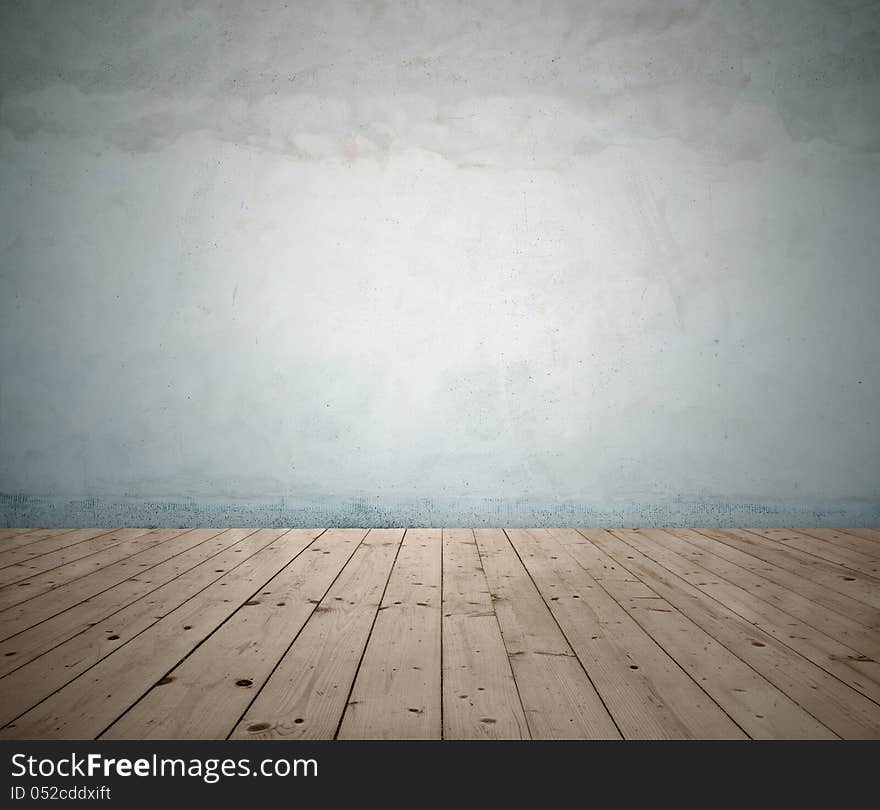 Image of wooden floor and cracked wall. Image of wooden floor and cracked wall