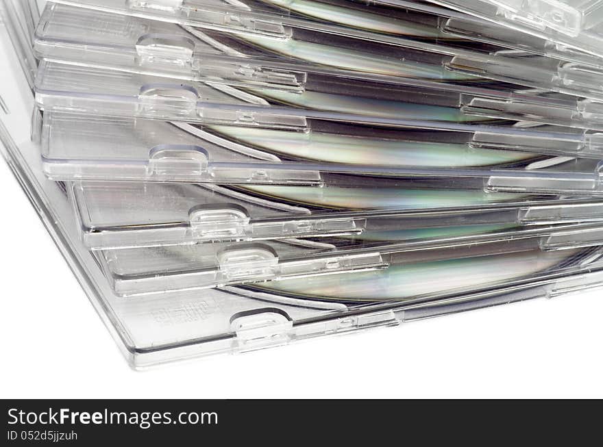 Stack of CD in Transparent Boxes closeup on white background. Stack of CD in Transparent Boxes closeup on white background