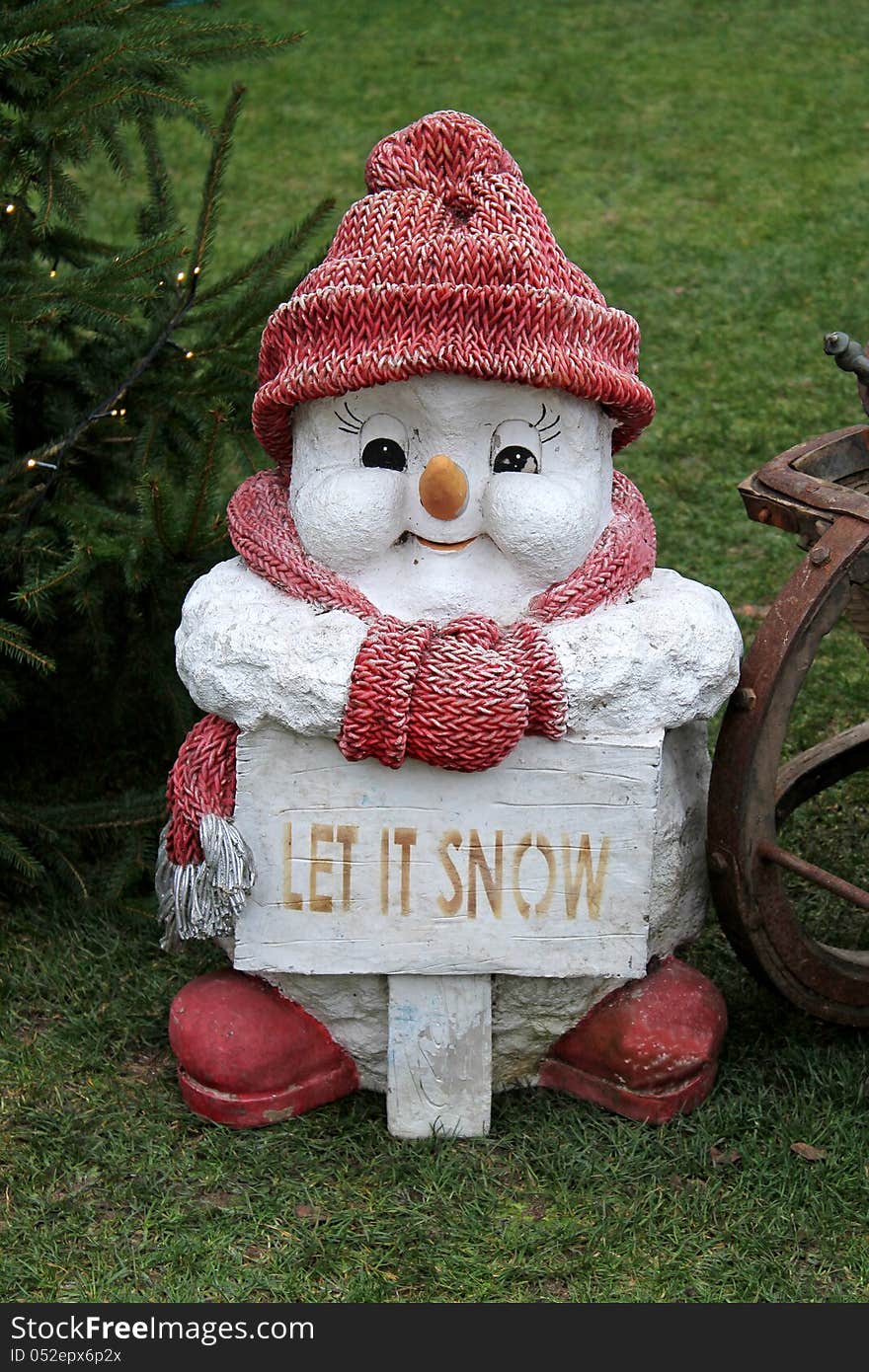 A Cute Little Model of a White Snowman Figure.