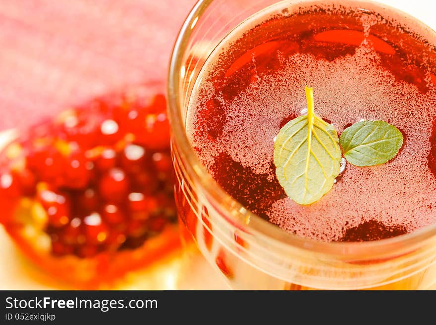 Colorful fresh ripe pomegranate and juice in the glass. Colorful fresh ripe pomegranate and juice in the glass