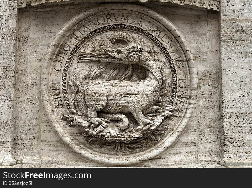 Bas-relief of a fire-breathing dragon on the facade of the Church of St. Louis of the French, titular church in Rome, Piazza Navona