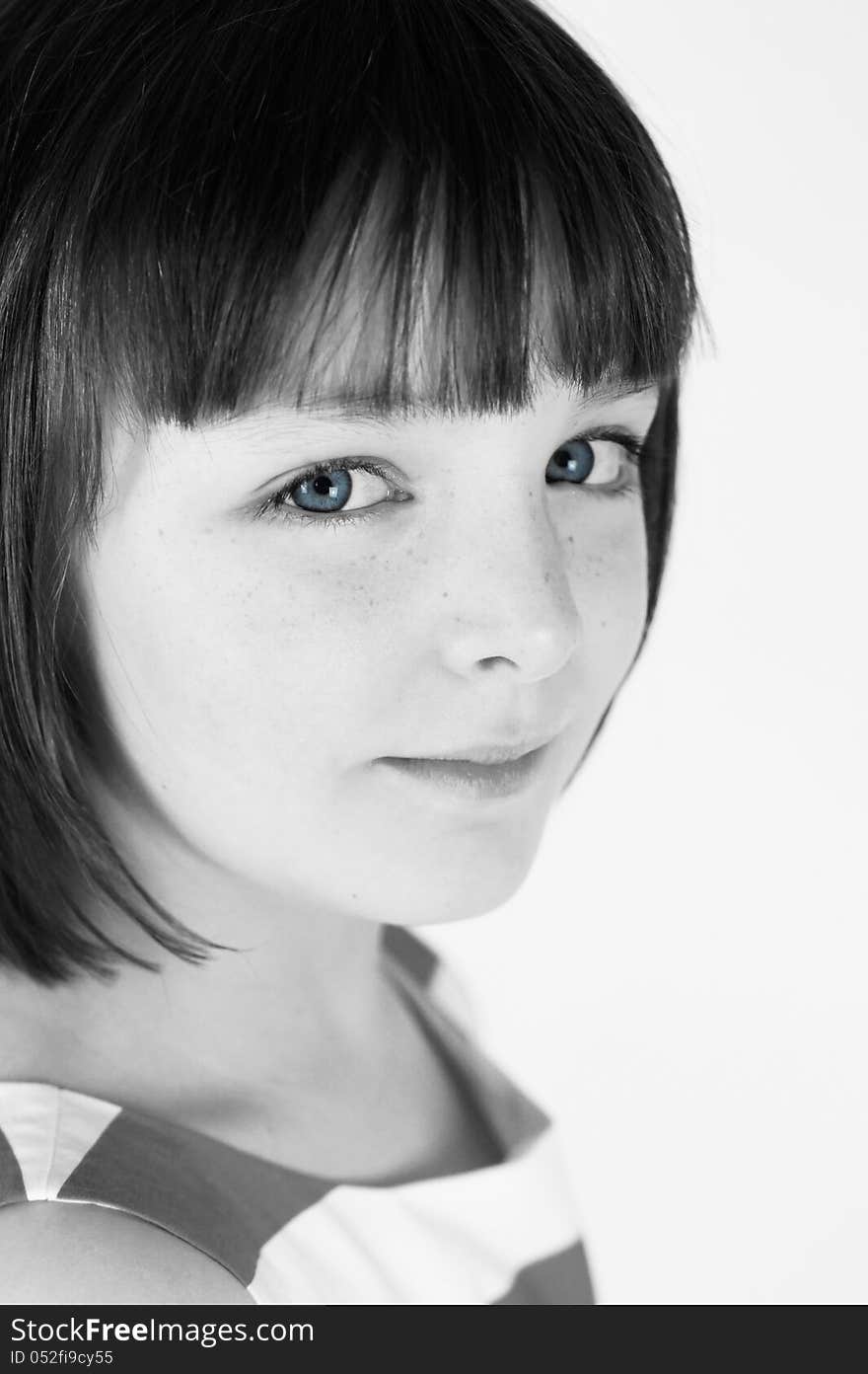 A simple black and white portrait of a pretty young girl with striking blue eyes. A simple black and white portrait of a pretty young girl with striking blue eyes.