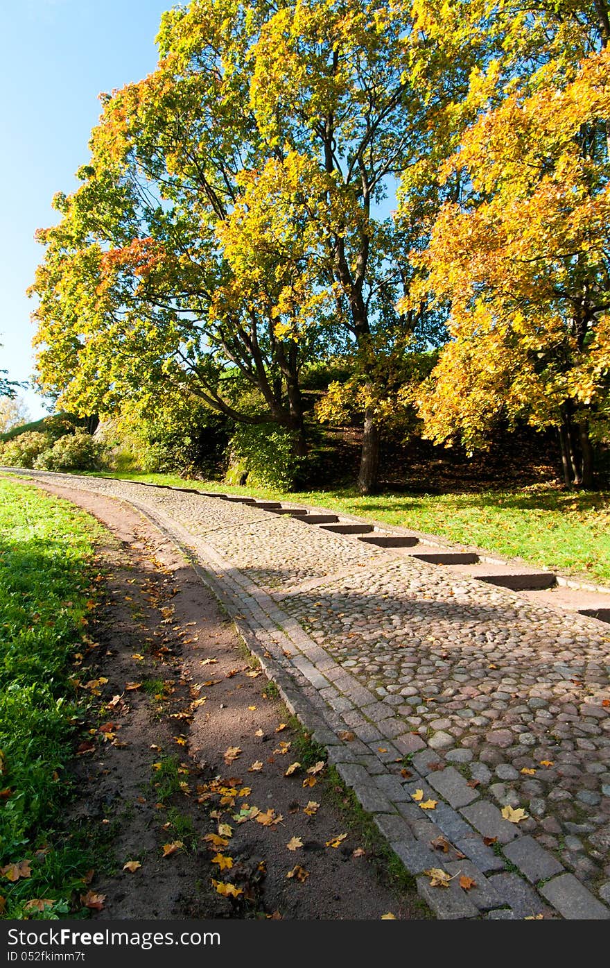 Road to the stairs in the park in autumn. Road to the stairs in the park in autumn