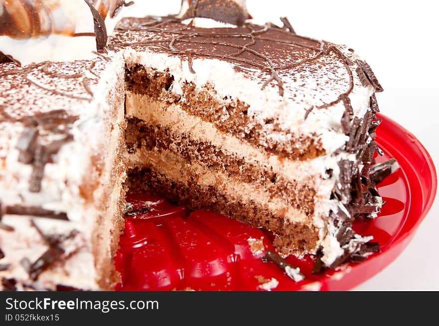 Cake chocolate on red plate