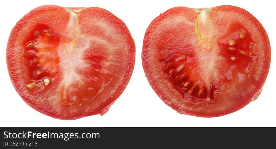 Two slices of juicy tomato isolated on a white background. Two slices of juicy tomato isolated on a white background.