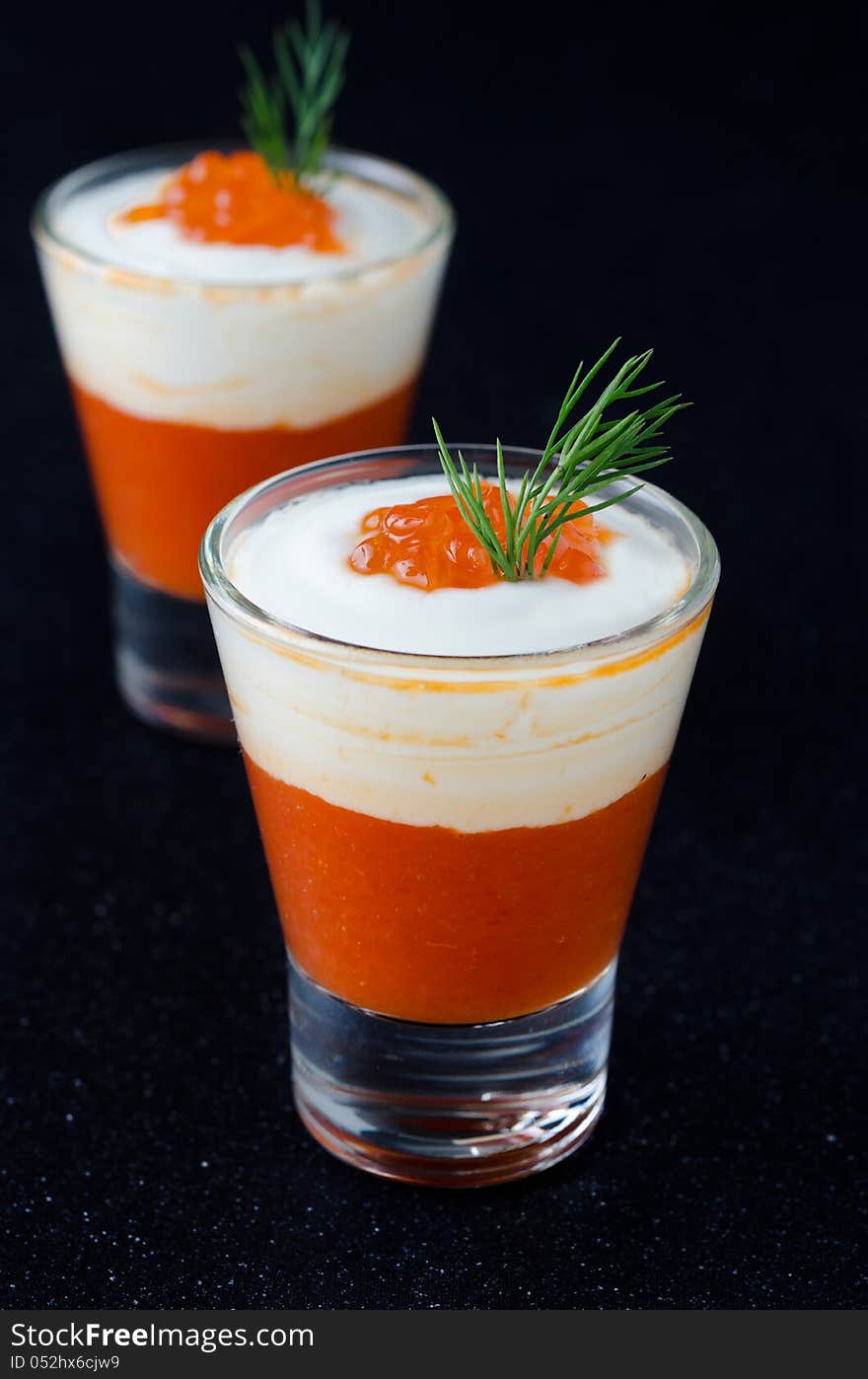 Appetizer of sweet pepper, cream and red caviar, two servings