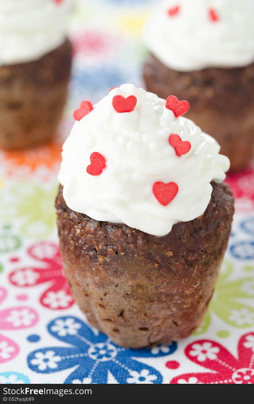 Chocolate cake with whipped cream, selective focus