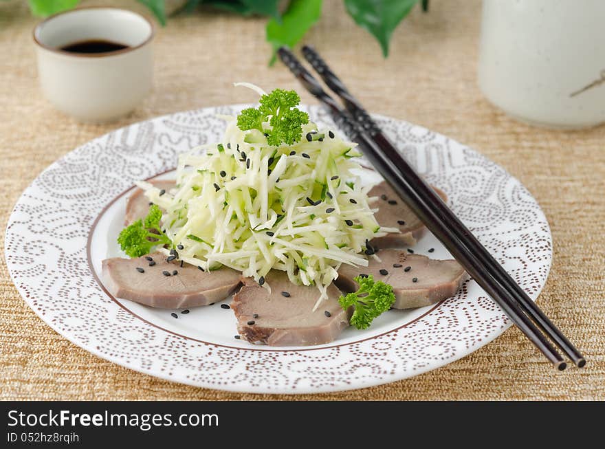 Oriental salad with beef tongue, celery and cucumber