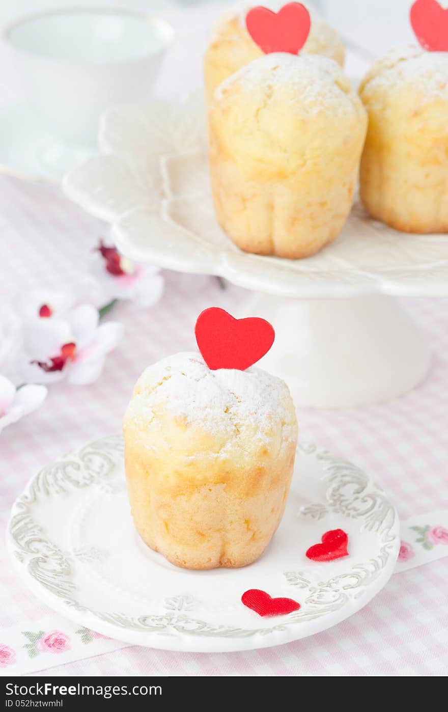 Rum Baba Decorated With Red Hearts On A Plate And A Few In The B