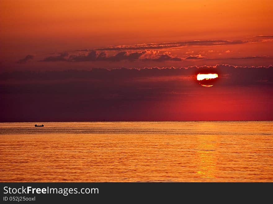 Beautiful sunrise at sea and boats go to fishing