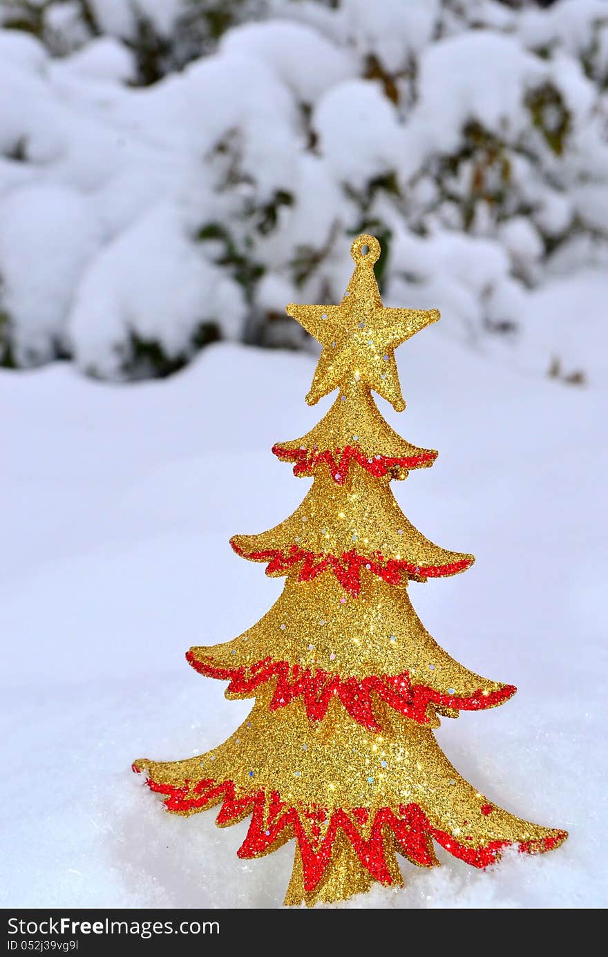 Image of a Christmas tree ornament on snow