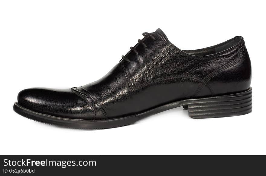 Sideways view of a mans low heeled classical black shoe with laces for everyday formal and office wear on a white studio background