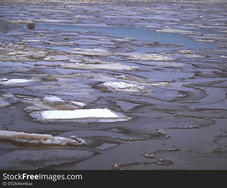 Dark Water Coming Through Shattern Ice